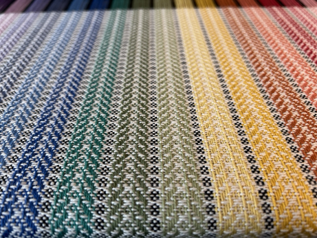 An oblique photo of a spiral twill teatowel warp on a handloom