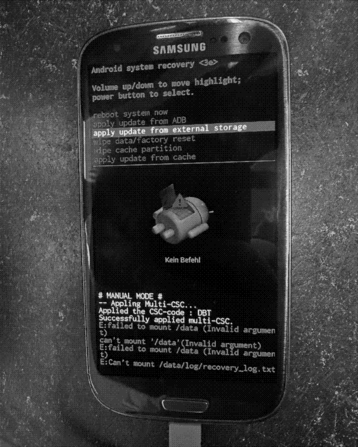 A Samsung phone showing a menacing-looking, textual "Android system recovery" interface.