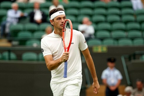 Taylor Fritz wins a set in his Wimbledon quarter-final.
