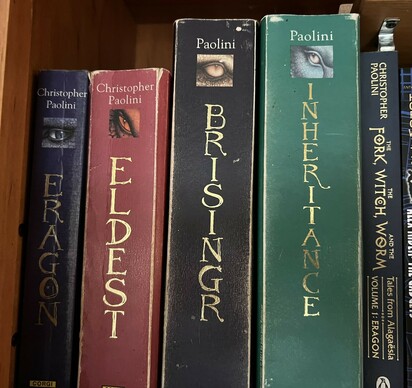 The books of the inheritance series by Christopher Paolini in three different sizes