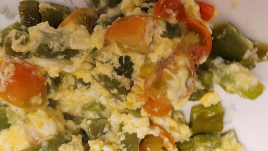 Cactus and tomato with scrambled eggs on a plate