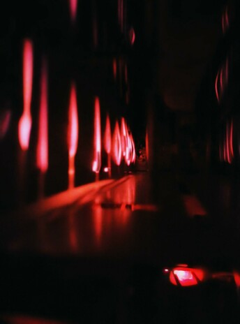 Closeup view of redly glowing toaster filaments as toast toasts in the toaster, round side down.