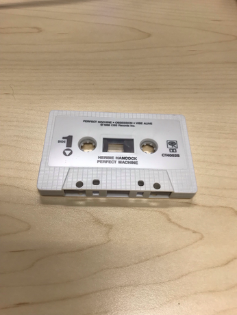 Herbie Hancock - Perfect Machine cassette, laying flat on a table