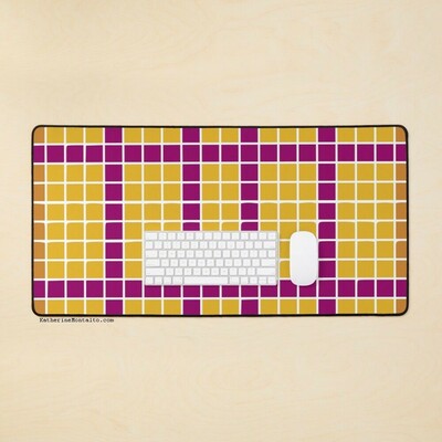 Abstract grid of multi-color squares printed on a desk mat