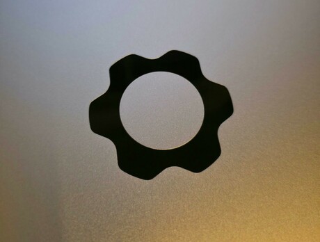 Picture of the Framework logo from the top of the Framework Laptop 16.