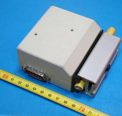 A big-ass Medium Attachment Interface Unit that gets clamped onto a thicc coaxal cable.

It's a bout tue size of a Desktop PC's Optical Disk Drive with a *WIDE* 15-Pin port at it to connect to tge actual Ethernet card.