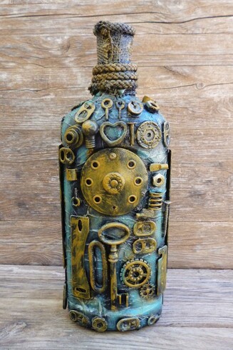 This image showcases a bottle that has been transformed into a captivating piece of art, embodying the steampunk aesthetic. The bottle's surface is richly adorned with a variety of small metal gears, rings, bolts, and mechanical components that are meticulously arranged in a seemingly random yet harmonious pattern. The overall color palette features aged brass and muted gold tones, which contrast with the greenish-blue patina, evoking a sense of antiquity and industrial craftsmanship.

The upper part of the bottle's neck is wrapped with a rough, twine-like material, adding texture and grounding the metallic elements with a natural, tactile element. The background consists of rough wood planks, which enhance the rustic and vintage feel of the composition.

This decorated bottle symbolizes the fusion of technology and artistry characteristic of steampunk culture, which draws inspiration from 19th-century industrial steam-powered machinery. The gears and mechanical motifs suggest the idea of movement, innovation, and the inner workings of machines, evoking curiosity about the secret mechanisms hidden within. The piece invites viewers to appreciate the beauty of intricate craftsmanship and the blending of old-world materials with imaginative design.