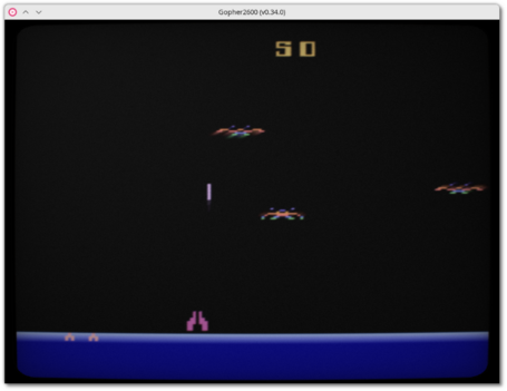 🕶️ A view of the game Demon Attack (a kind of Galaxian in which 3 ships move in various motions and shoot at the player's ship at the bottom of the screen) running on Gopher2600 on my Linux PC.

📚️ Gopher2600 is a libre, multi-platform emulator of the Atari 2600. It's highly accurate, and among other things offers emulation of 6507, TIA and RIOT chips, supercharger, Harmony, UnoCart and PlusCart cartridges, stick, paddle, keyboard and SEGA Genesis-type controllers, and support for the network, AtariVox and SaveKey, CRT TV effects, screen capture, game recording and playback, game rewind, ROM selection with live preview, boxart. Its graphical debugger allows interaction at CPU and color clock level, breakpoints, traps, watches on various CPU, TIA and RIOT targets, and ARM monitoring.