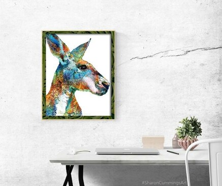 Colorful kangaroo head in a rainbow of collaged painted fabric in a home office setting by artist Sharon Cummings.