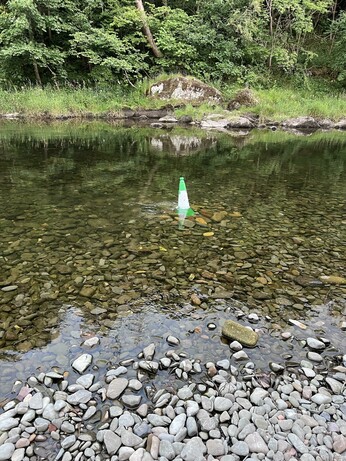 Some bar stuard has dumped a traffic cone in the end in the river