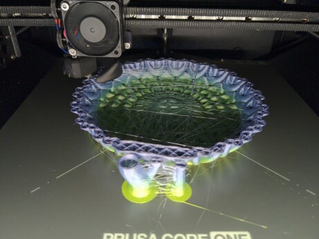 A bowl being printed, which got stringy.