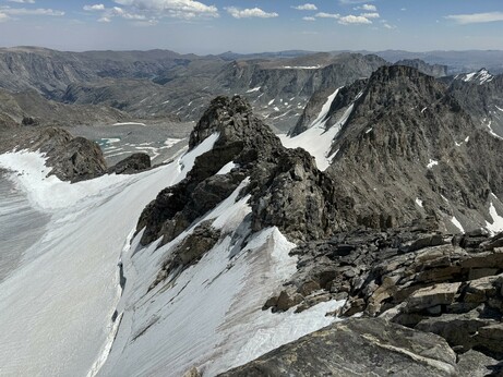 View from the top of Fremont Peak. A rocky ridge with a glacier to the left.