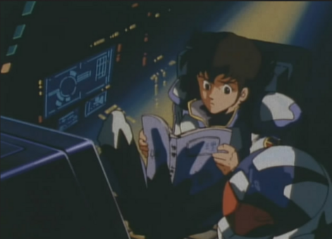 the teenage boy in a cockpit of the robot, he is reading a manual