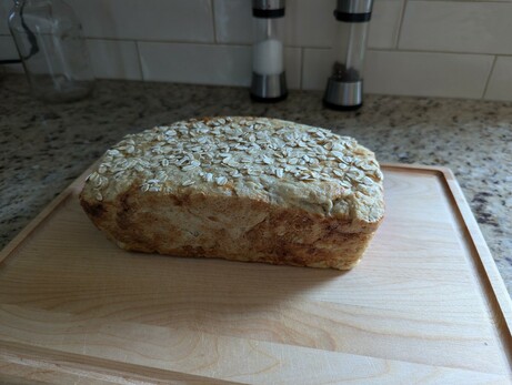 A loaf of bread with a flat top and oddly dramatic lighting.