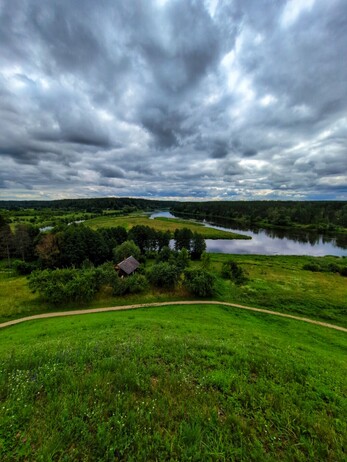 View from the top of the hill, looking down towards the Merkinė River.