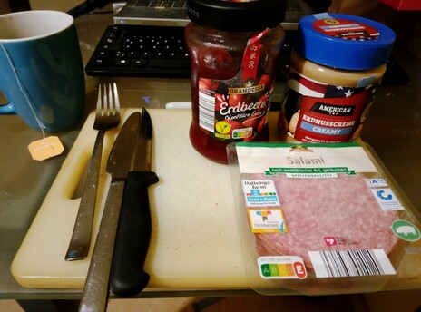 All the fixin's for Sweet and sour pork sandwiches: creamy peanut butter, strawberry preserves, and salami.