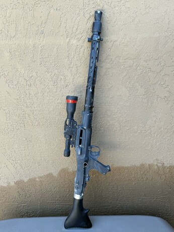 A modified (8 inches of barrel/shroud shorter) DLT-19X heavy blaster rifle, now weathered.