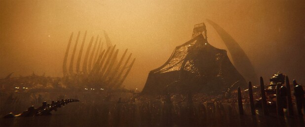 Wide shot, exterior, "day" -

A tent like structure made of stretched intestinal lining  sits on the bank of a river of reddish-brown fluid, in a flesh-world covered in bits of bone, goo and fat.