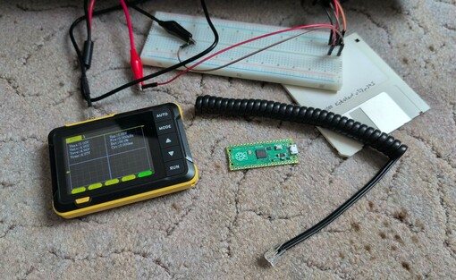 Oscilloscope, cable with rj10 connector, breadboard, Raspi pico