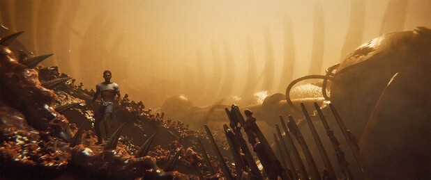 Wide shot, exterior, "day"

An immense ribcage claws its way out of the fleshy 'ground'.  Next to it, a wreck of some sort of airship was long ago used as an origin point for various pipes that extend along the spine and into the ground.

A man in tattered clothes stands in the foreground.