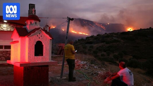 One dead, evacuations underway after wildfires stoked by gale-force winds sweep through Greek towns