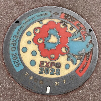 One of Japan's trademark manholes, with the EXPO 2025 mascot, which has gotten mixed reviews among Japanese people