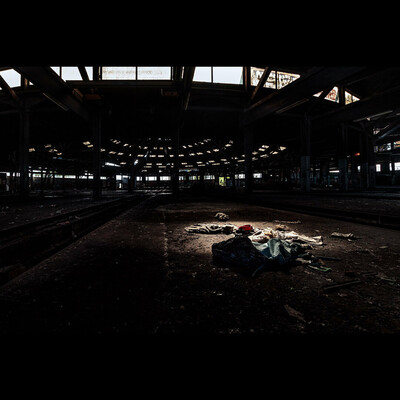 Abandoned trains hangar, with light on lost objects, Urbex, France