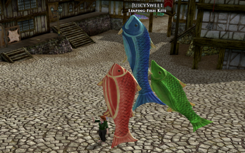 One of my LOTRO characters holding a kite that is 3 fish in bright colours. As this is technically a "pet" in LOTRO, you can name it. So I called mine "Juicy Sweet" because that's how Gollum likes to eat his fishes - as well as raw and wriggling.

Nom nom nom.