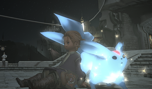 How to describe this? A ginger male Lalafell (halfling in FFXIV) with a moustache, is sat on the paved ground, with his back against a bright blue Carbuncle. This is like a longer, blue Pikachu with either three tails, or  three feathers that look like three tails. Oh and it sparkles.