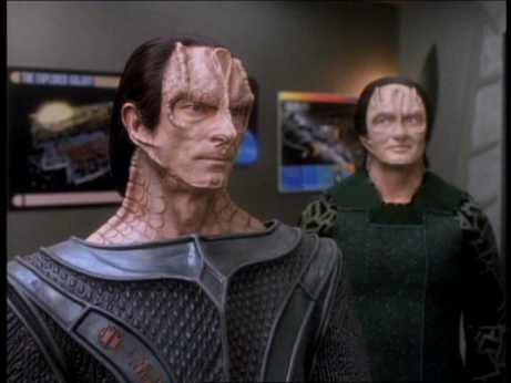 Two Cardassians, the one in the front (Gul Dukat) has a particularly thick neck.