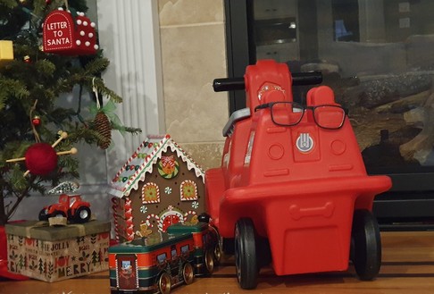 Fire truck scooter wearing glasses.