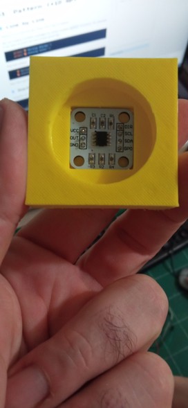 A 3D printed socket for an Arduino AS5600 position sensor module, front view.