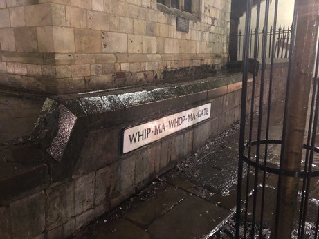 A street sign saying Whip-Ma-Whop-Ma-Gate