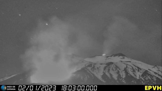 In the middle right of the image, a bright spot (glow) can be seen above the snow-covered summit craters. The glow is above the Bocca Nuova. In the left half of the image, a very large bright area can be seen. This is caused by the eruption/lava flows at the northeastern base of New Southeast Crater.