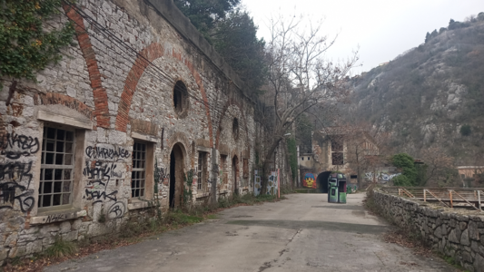 More abandoned buildings in the ravine next to the path.