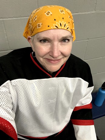 Sweaty and makeup-free in my hockey jersey and gold bandana. 