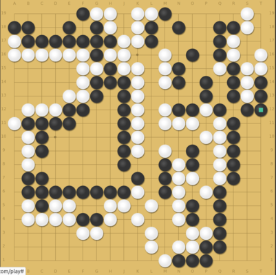 A Go game in progress. Black has just defended two stones in atari, but should have done something else.