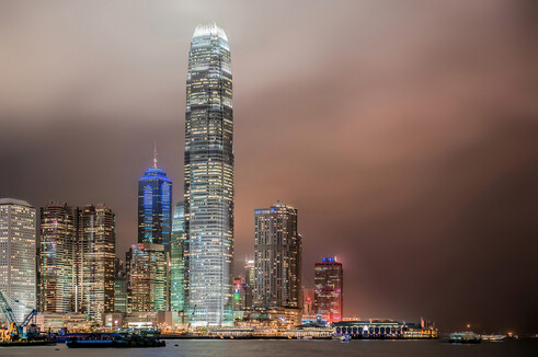 "Hong Kong skyscrapers in a night of typhoon".