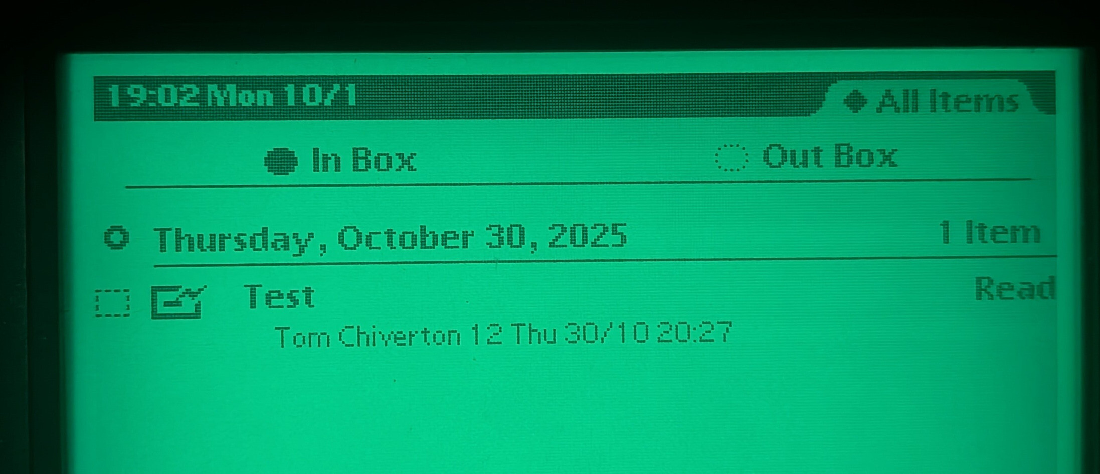 A screenshot of a backlit Apple Newton "in box" showing a read email has arrived.
Black text on glowing green.